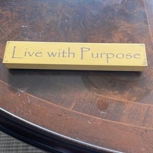 Yellow sign that says Live with purpose